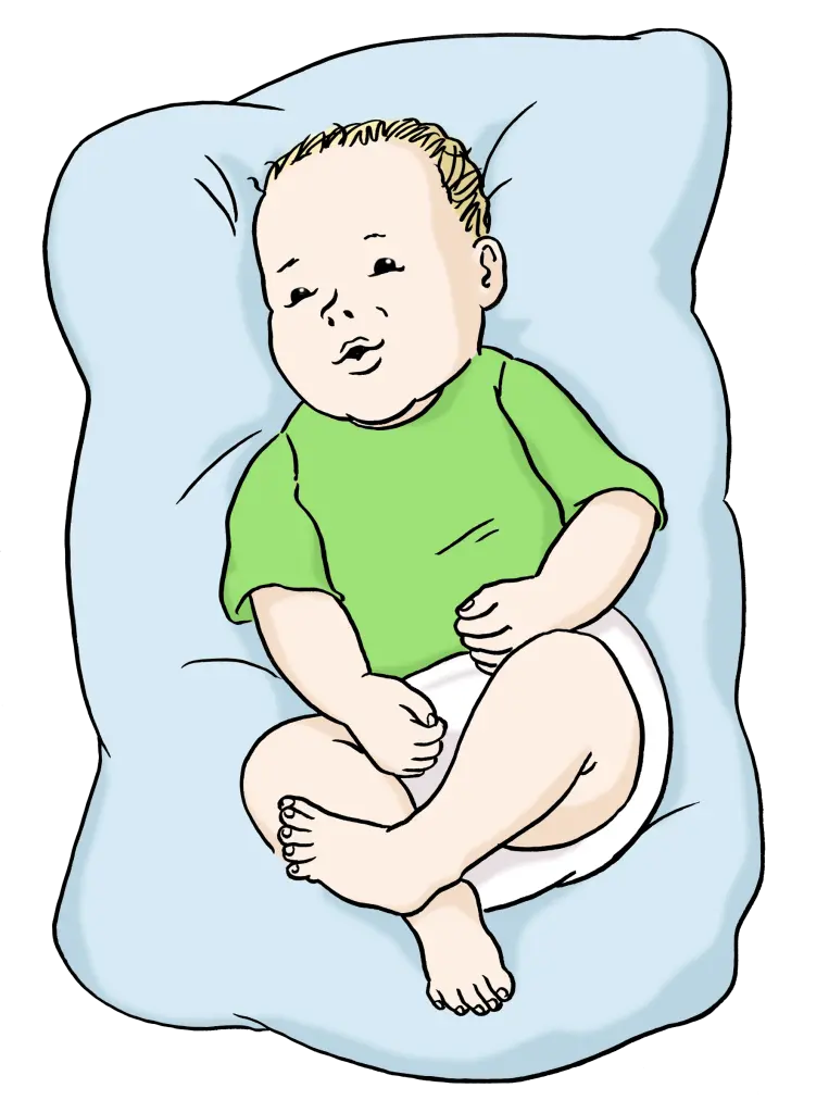 Ein Baby liegt auf einem Kissen und schläft.